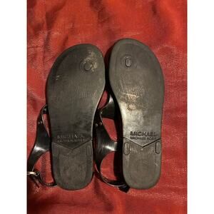 Michael Kors Sandals Womens Black Jelly Thong Flat Logo Plate Buckle Gold Ankle